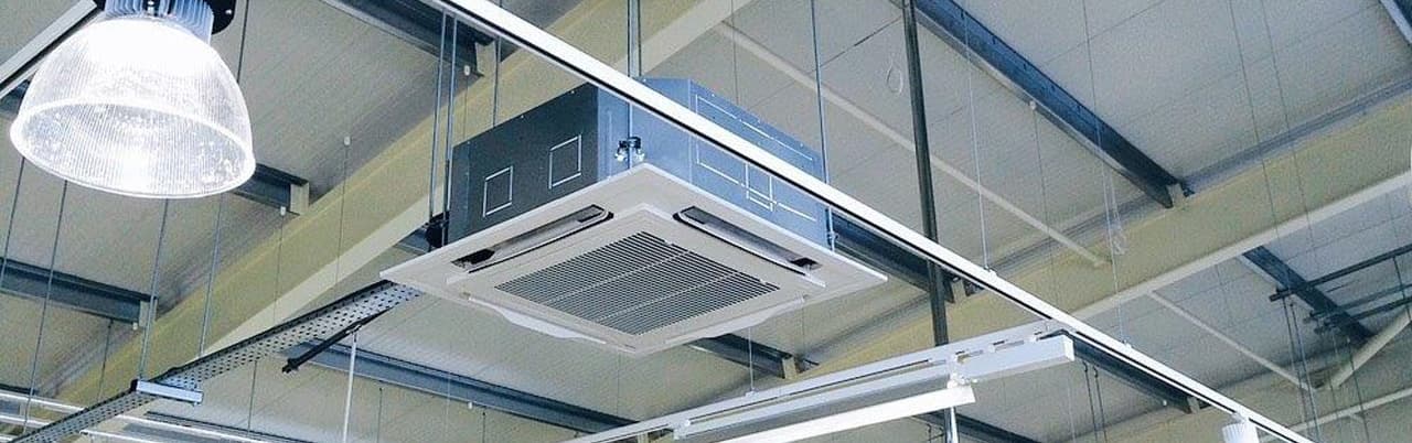 Indoor ceiling cassette air-conditioning unit installed by Cool Solutions — commercial cooling.
