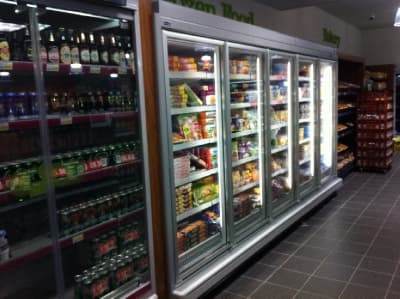 Multi-deck drinks fridge aisle install by Cool Solutions — convenience retail refrigeration.