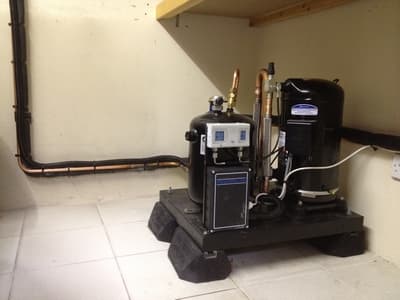 Interior refrigeration plant room with compressor by Cool Solutions.
